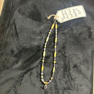 Elegant Beaded Necklace with Yellow and Purple Accents